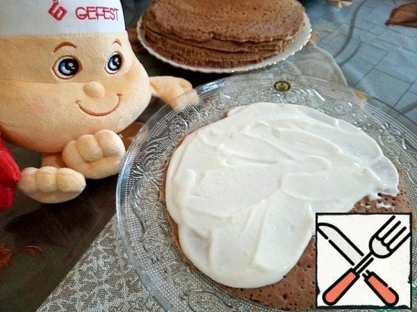 Put the cakes with holes up and liberally lubricate with cream.