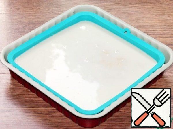 Pour the milk mixture on the warm cake. Don't worry, the cake will absorb all the sherbet. Cover the dessert with cling film and send it to the refrigerator for at least 3 hours, or preferably overnight.