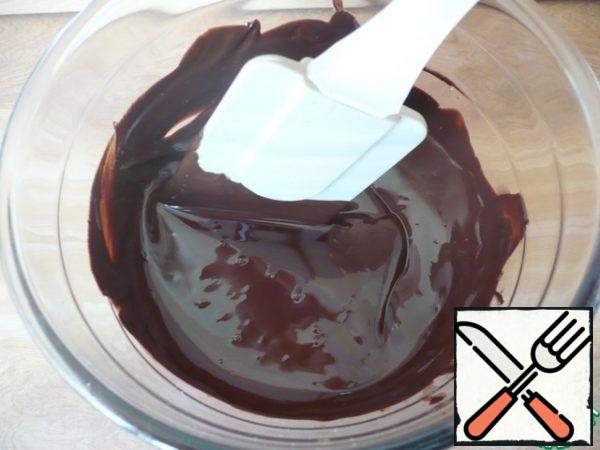 Melt the dark chocolate pieces in a convenient way.