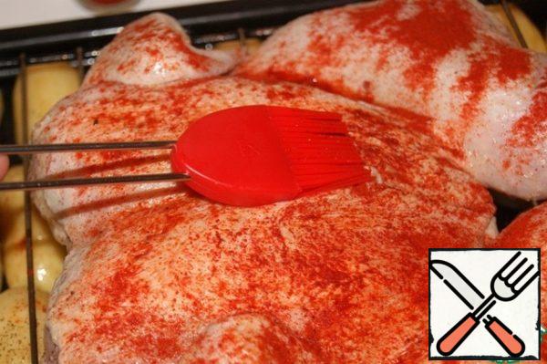 Sprinkle with paprika and use a brush to cover the chicken nicely.