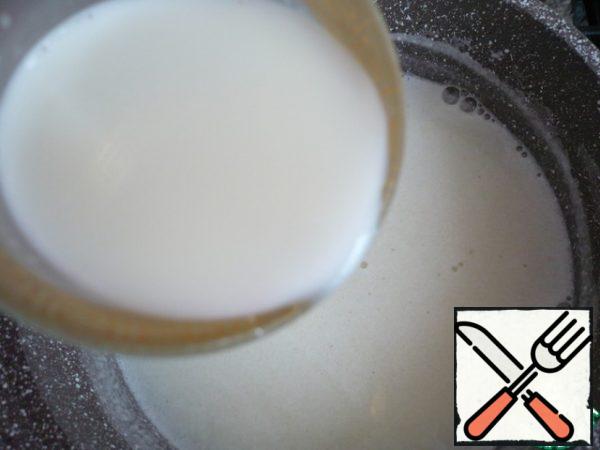 Then add sugar to the boiling milk and boil until the sugar dissolves. Dilute corn starch with milk and add to the milk mixture and boil, stirring constantly. Then remove from the heat.