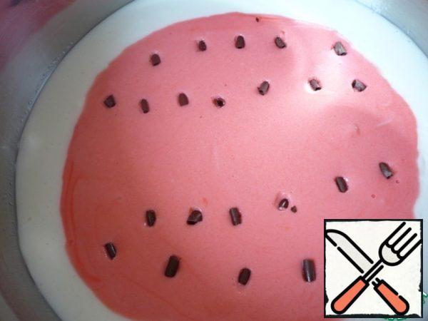 Decorate the red part of the "watermelon" with chocolate chips imitating "watermelon bones".