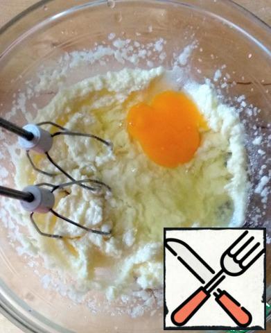 Add one egg at a time, beating with a mixer.