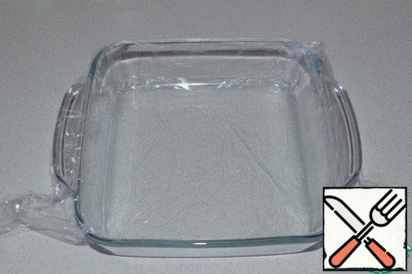 Cover the form with plastic wrap and grease with vegetable oil.