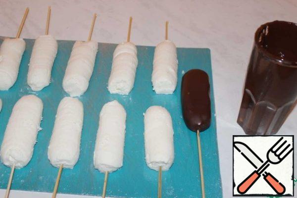 Dip the cheese in the chocolate.