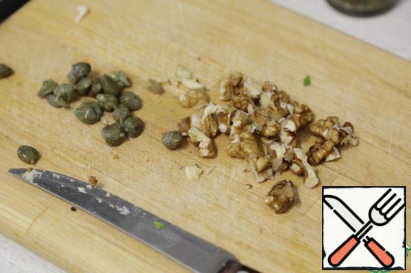 Cut the nuts into pieces.
You don't have to add capers, I just like them better.