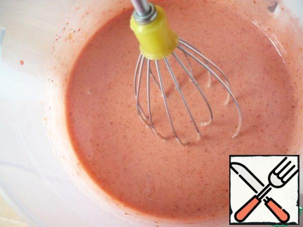 With a whisk, whip the weight from the yolks and strawberry puree. You should get an airy, creamy mass.