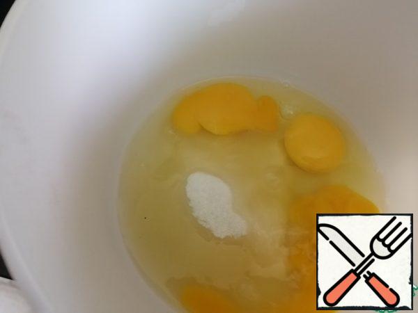 Beat eggs and sugar well with a mixer until fluffy.