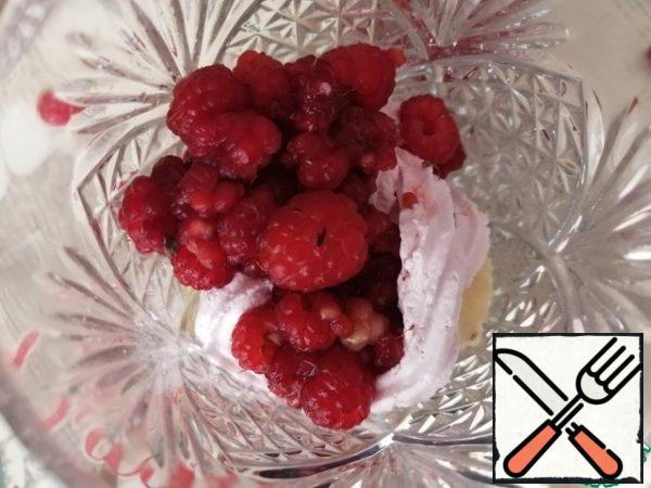 Cream again, fresh raspberries, a layer of sponge cake.