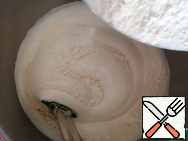 Add the flour and mix gently with a spatula until smooth.