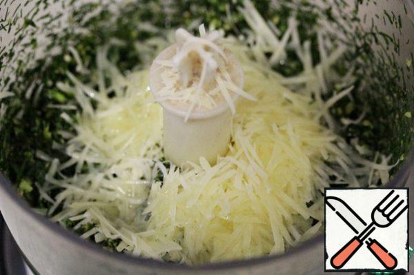 Add grated cheese and 50 ml of oil. Re-enable the combine and chop everything until a uniform paste is formed.