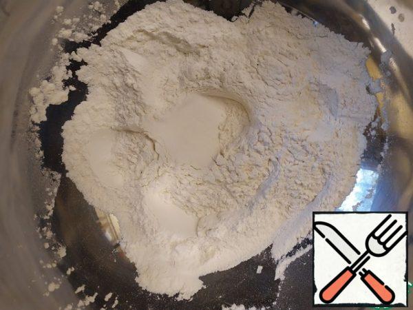 The butter should be removed from the refrigerator at least an hour before cooking, so that it is well softened.

If you have vanilla extract, it is better to use it (instead of vanilla sugar). Add salt and water to the flour and knead the dough. It should be quite sticky.