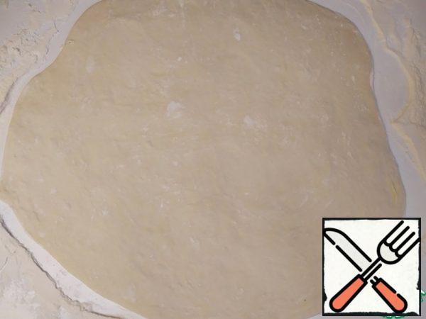 Then roll out the dough into a square (or so).