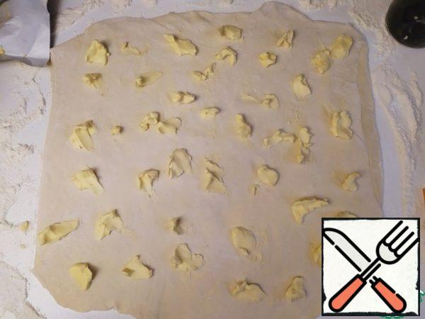 Now spread the remaining third of the butter on the entire dough.