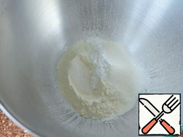 In a bowl, mix the flour, baking powder, vanilla sugar and salt.