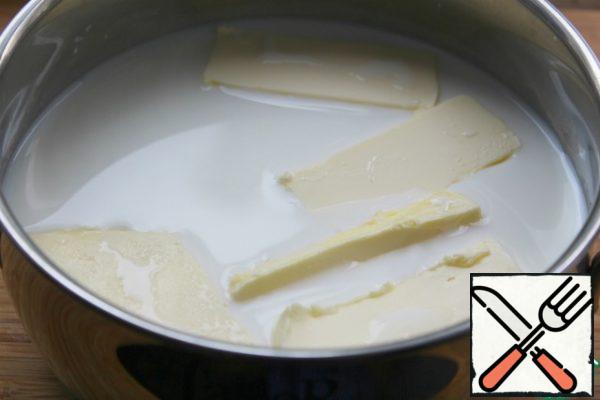Boil the milk and add the butter.