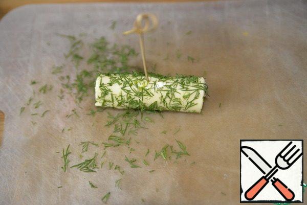 "Roll" on chopped dill, insert a skewer.
