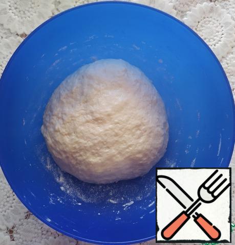 Grease your hands with oil and knead a soft, sticky dough.
Leave the dough for 30 minutes in the heat, covered with a towel.
