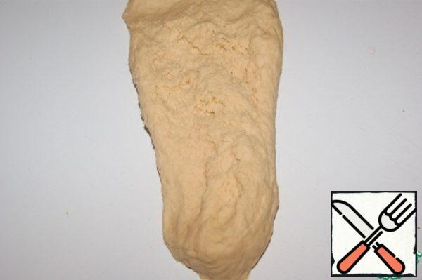 Place the dough on the work surface. Knead it for at least 5 minutes. Stretching in different directions...