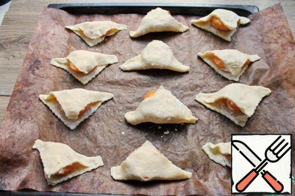 Put in a hot oven and bake for 15 to 18 minutes, until the edges of the dough are lightly browned. The dough is low in sugar, so do not expect a strong blush on them.