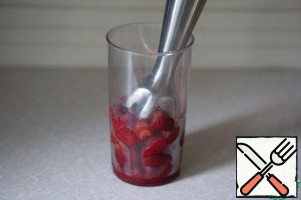 Chop the strawberries into a puree.