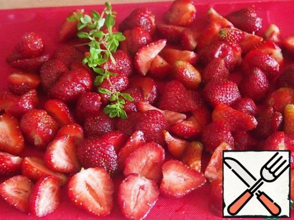 Wash the berries and cut them into halves.