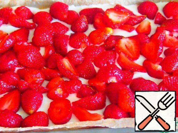 Spread the strawberries on top.