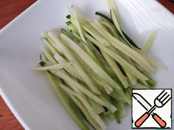 Cucumbers cut into thin long strips.
