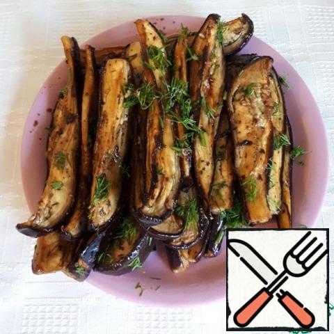 Put the finished eggplant appetizer on a plate and sprinkle with dill. Serve eggplants cold, they are especially delicious after cooling in the refrigerator.