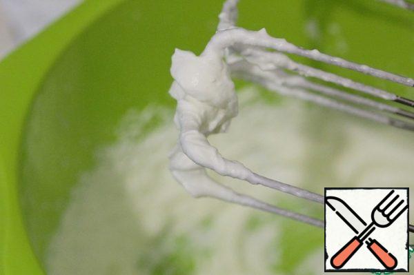 Beat the cold cream to stiff peaks.