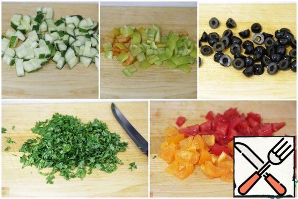 Cucumber and sweet pepper cut into cubes, tomatoes clean from seeds and also cut into cubes, olives-into halves, coriander finely chop.