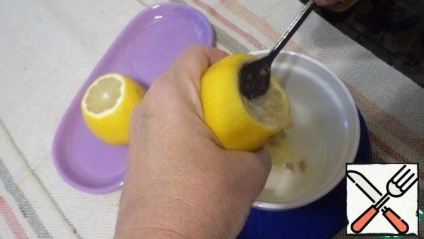 Carefully remove the pulp from the lemons with a spoon.
