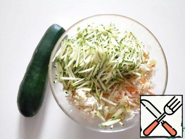 Cut the zucchini into thin strips and add to the vegetables.