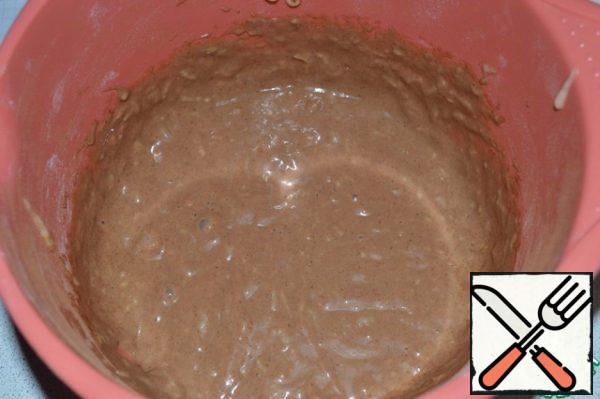Divide the dough into two parts.
Add cocoa to one and mix.
