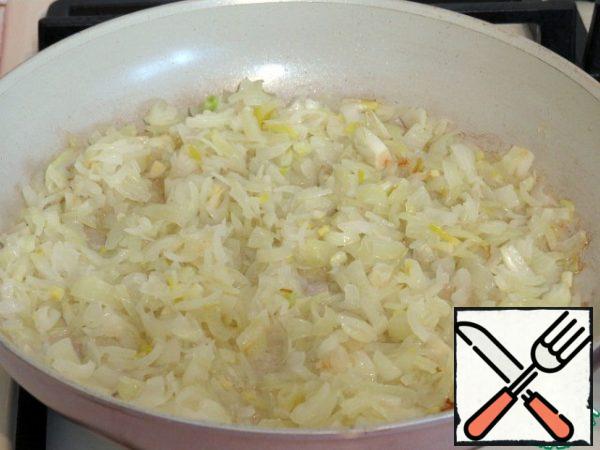 Finely chop the onion and fry in vegetable oil until Golden.