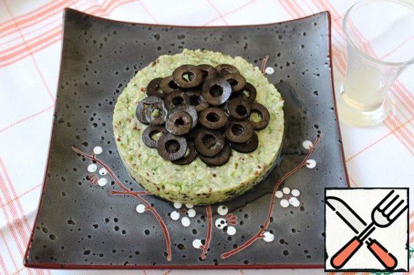 Top with sliced olives.
