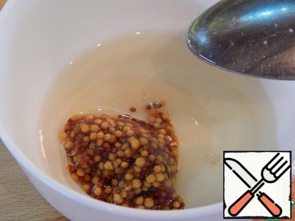 In a bowl, combine the mustard, oil and wine vinegar. Add pepper and salt to taste.