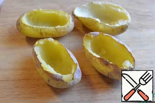 Remove the middle of the baked potato with a teaspoon.
This will be the base of a salad or plate )))

Do not throw out the baked potato pulp, pour olive oil, add herbs, lightly salt, squeeze out 1 small clove of garlic, you will get a very simple and very delicious salad for 1 serving.