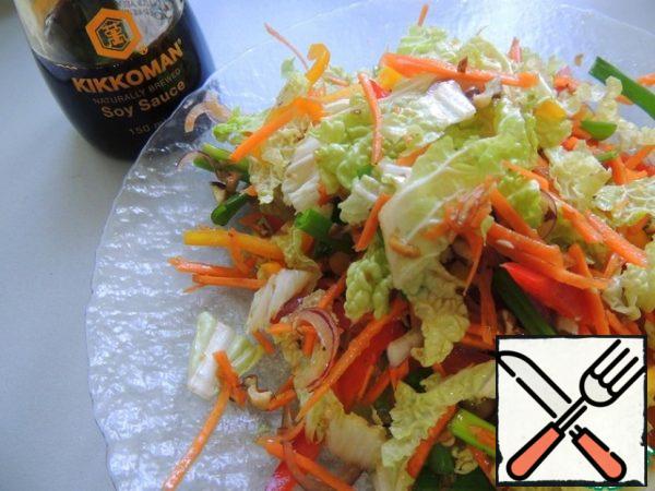 Combine all the vegetables, add the onion cut into half rings, crushed nuts. Fill with the dressing and mix gently, preferably with your hands, so as not to damage the vegetable straws.
