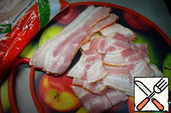 We cut the bacon (I have strips) into 4 parts each.