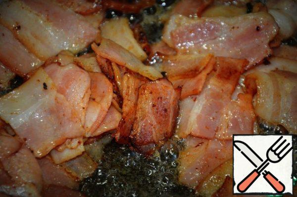 Fry it without oil and put it on a napkin to take the extra oil.