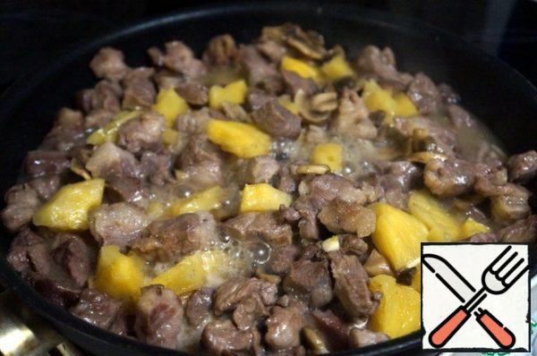 Add the pineapple along with the juice and garlic. Add salt, pepper, mix, and simmer without lid on medium heat for five minutes.
