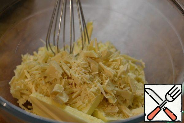 Melt the white chocolate and 100g of butter in a water bath, stirring constantly. Leave to cool.