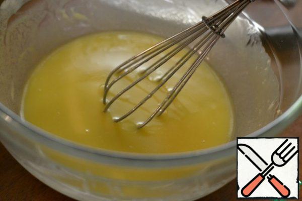 Add the cooled chocolate and flour with baking powder.
Stir.