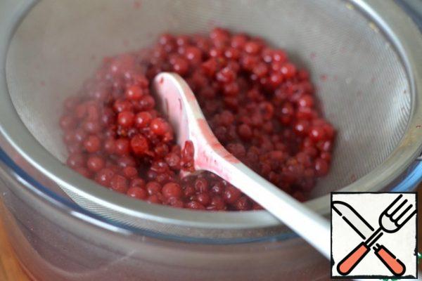 RUB the red currant through a sieve.