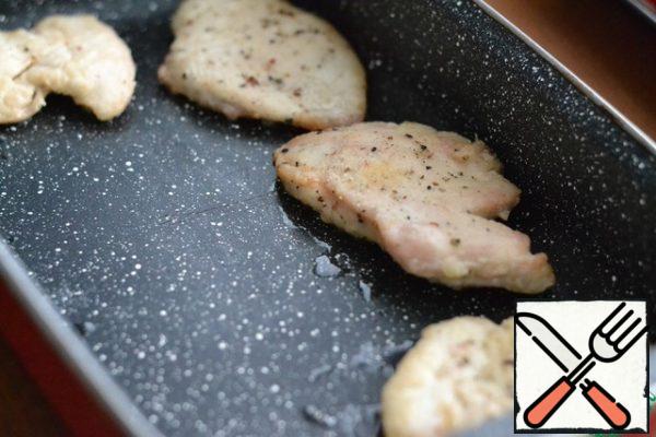 Place the fried breast in the prepared baking dish.