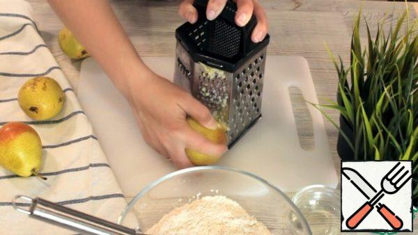 Then grate the pears on a fine grater. You can peel it, but I like it.