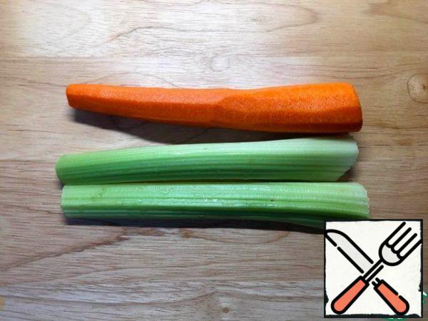 Peel the carrots and celery.