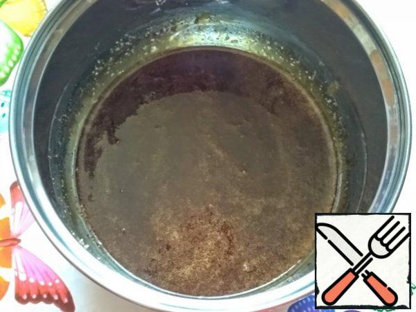 After most of the mixture becomes runny, you can start stirring it a little, but it is better to just tilt the pan from side to side, so that the future caramel does not burn.