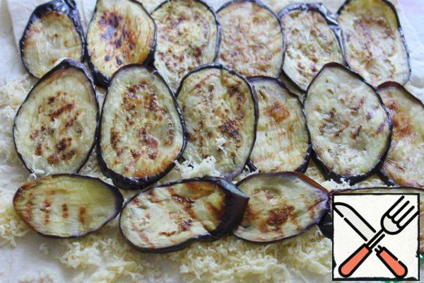 Put the eggplant on the cheese.
Add a little salt.